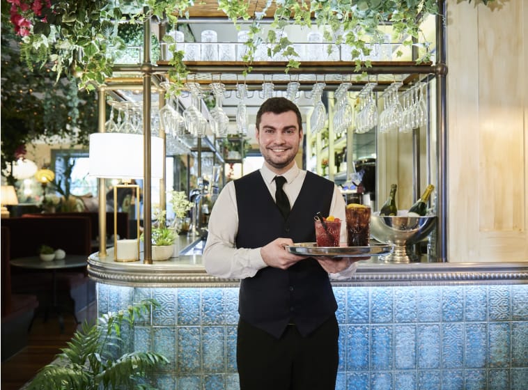 hotel waiter holding drinks