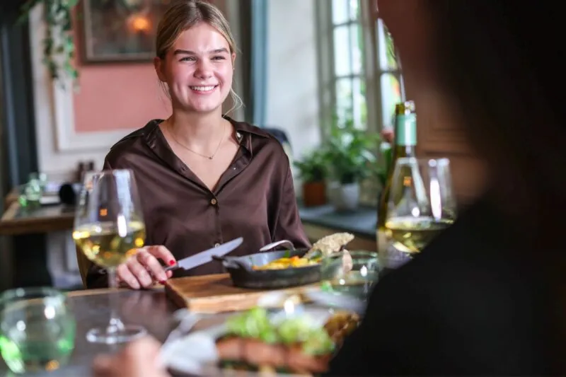 The Castle Hotel Windsor smiling lady eating in Lea
