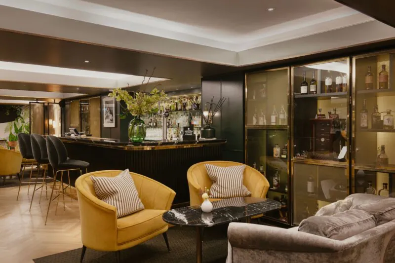 The Athenaeum Hotel & Residences bar with the whisky wall