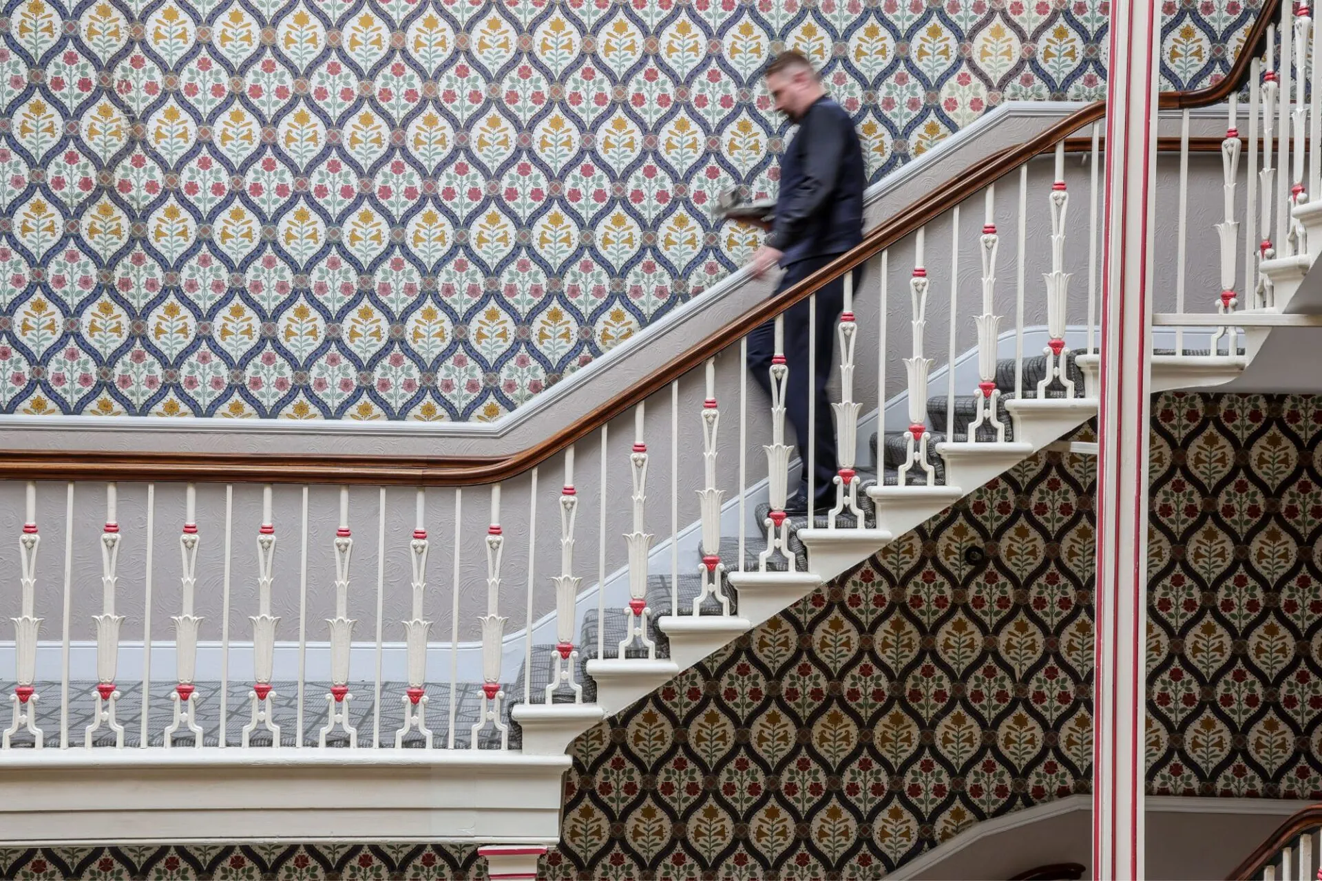 The Queens Hotel Cheltenham waiter on the stairs