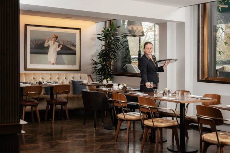 The Athenaeum Hotel & Residences waitress in the restaurant